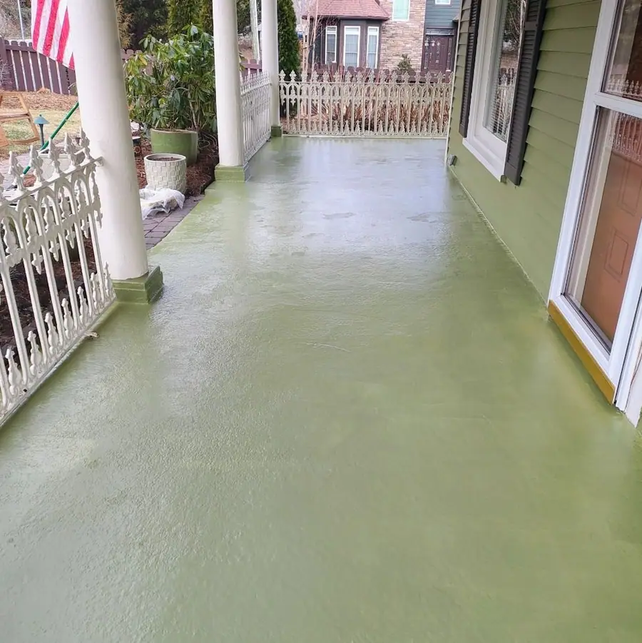 The same porch floor finished with two coats of green floor paint